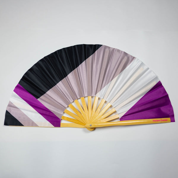 Asexual flag bamboo clack fan featuring black, grey, white and purple Ace pride stripes. Large folding Pride fan perfect for festivals, drag shows and queer events.