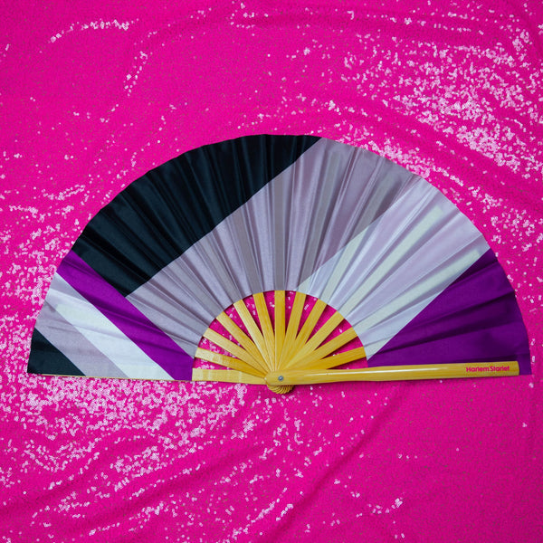 Asexual flag bamboo clack fan featuring black, grey, white and purple Ace pride stripes. Large folding Pride fan perfect for festivals, drag shows and queer events.