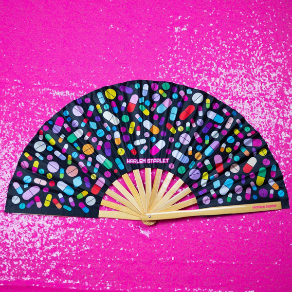 Take Your Meds bamboo clack fan with colourful medicine pill print. Large folding rave and festival fan perfect for Pride, drag shows and queer nightlife.
