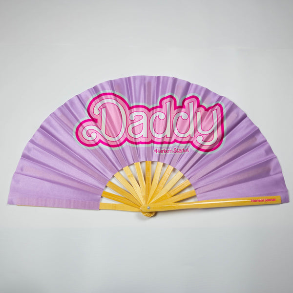 Daddy bamboo clack fan by Harlem Starlet, a funny pride statement hand fan perfect for Pride festivals, drag shows, queer parties and rave dance floors.