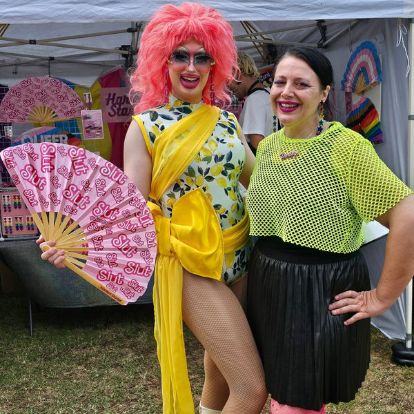Pink Slut bamboo clack fan by Harlem Starlet, a funny pride statement hand fan perfect for Pride festivals, raves, drag shows and queer dance floors.