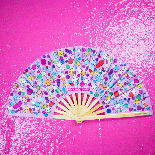 Take Your Meds bamboo clack fan with colourful medicine pill print. Large folding rave and festival fan perfect for Pride, drag shows and queer nightlife.