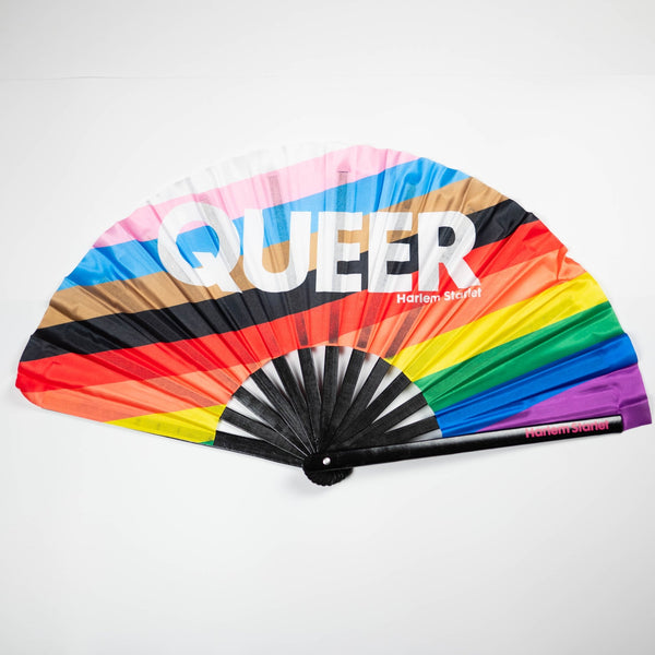 Queer Progress Pride Flag bamboo clack fan featuring the inclusive rainbow Pride colours, perfect for Pride festivals, marches, queer events and LGBTQIA+ celebrations.